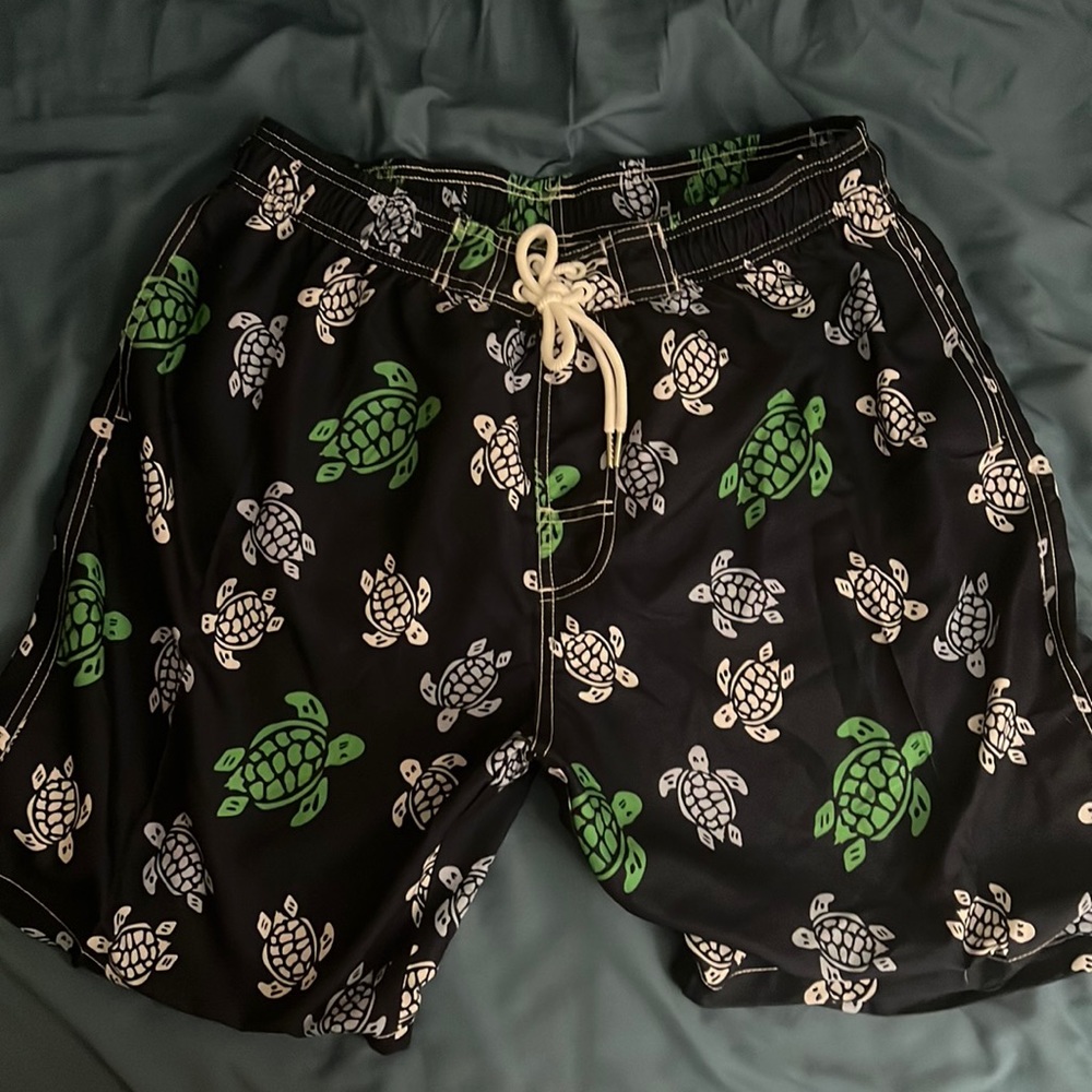 Men’s navy blue swim trunks with green, blue and White Sea turtle print